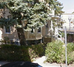 Photograph of approach to building.